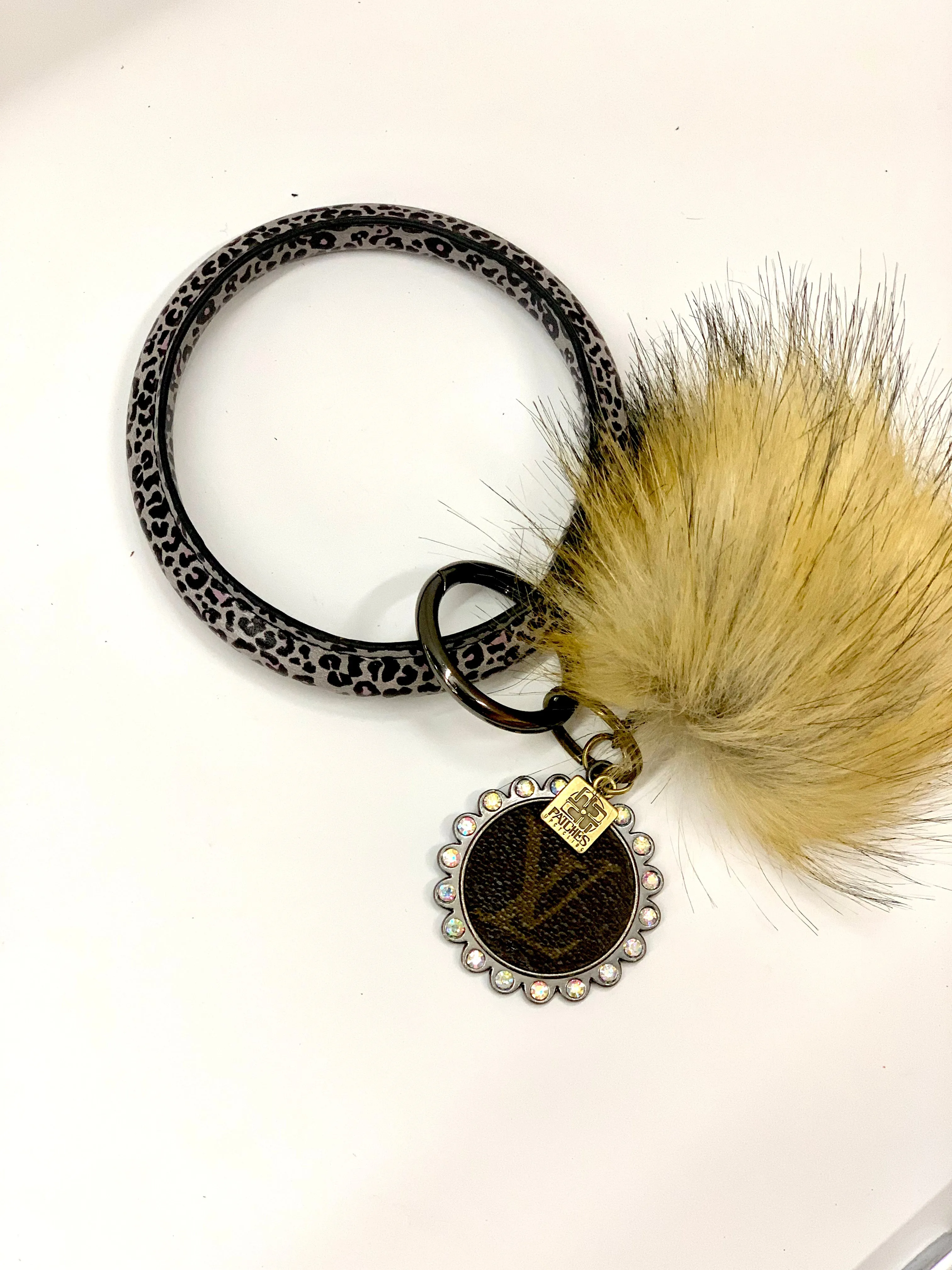 O Ring Keychain in black & white cheetah with puff ball
