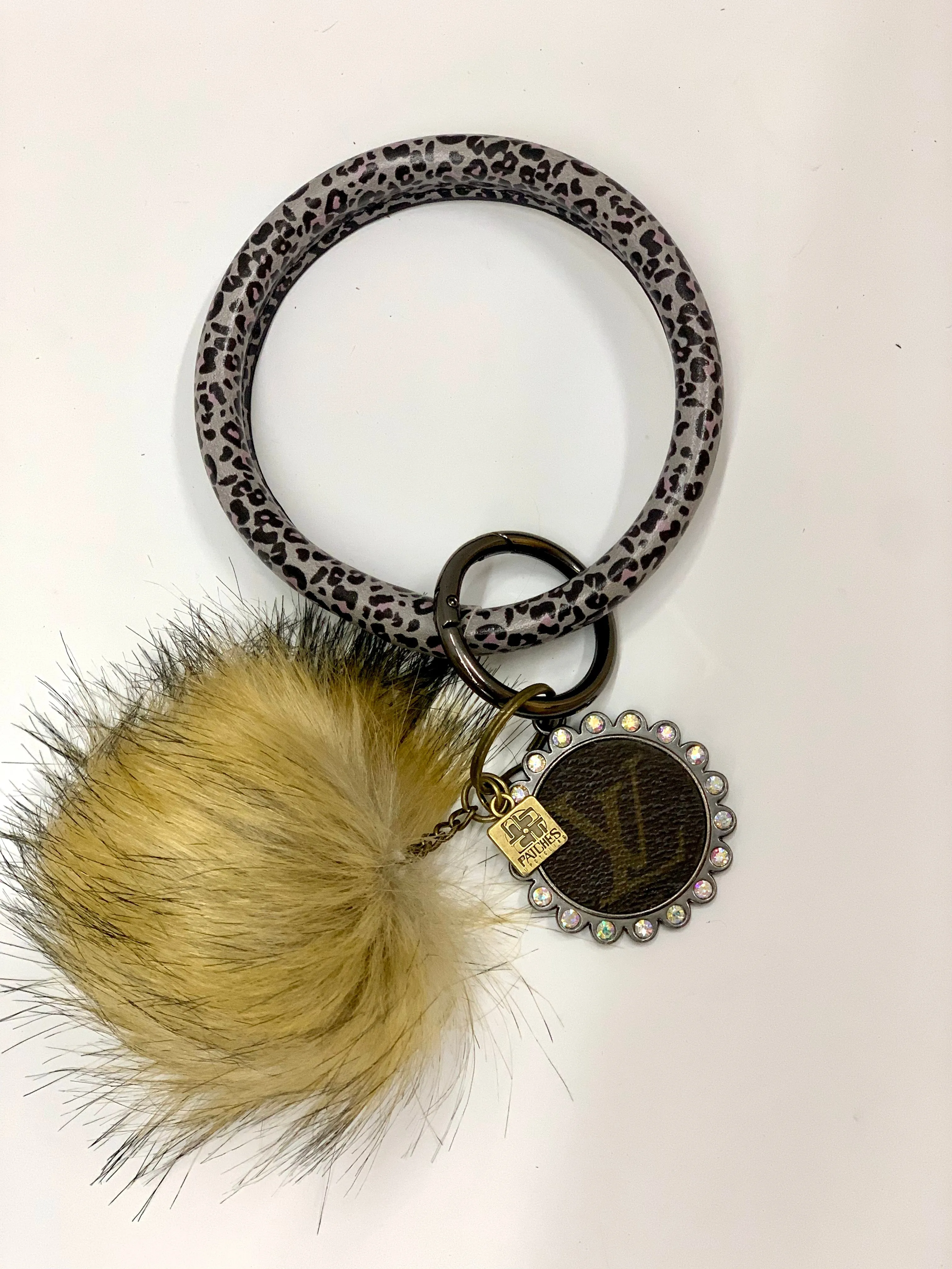 O Ring Keychain in black & white cheetah with puff ball